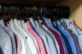 Men`s shirts on hangers in the wardrobe Royalty Free Stock Photo