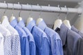 Men`s shirts are hanging in the closet Royalty Free Stock Photo