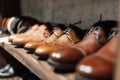 Men`s shoe boutique. Brown leather men`s shoes stand in a row on a store shelf. Brown Men`s Derby in a Store Window.