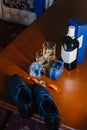 Men`s shoes, a belt rolled up by a ring, watches, cologne, a bottle of alcohol, two glasses with alcohol and an Royalty Free Stock Photo