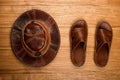 Men`s shoes on the boards. Slippers close-up. Men`s brown sneakers. Summer shoes Royalty Free Stock Photo