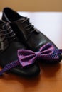 Men`s shoes and bow tie. Wedding accessories Royalty Free Stock Photo