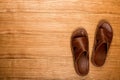 Men`s shoes on the boards. Slippers close-up. Men`s brown sneakers. Summer shoes Royalty Free Stock Photo