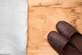 Men's slippers on the wooden table Royalty Free Stock Photo