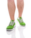 Men`s sports legs in sneakers.