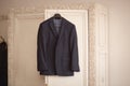 Men`s suit hanging on trempel