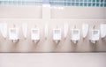 Men`s toilet public with white porcelain urinals stall, Modern  clean bathroom for a pee Royalty Free Stock Photo