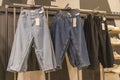 men's trousers on hangers in the store Royalty Free Stock Photo