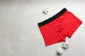 Men`s underwear and cotton flowers on grey marble background, flat lay Royalty Free Stock Photo