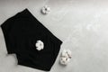 Men`s underwear and cotton flowers on grey marble background, flat lay Royalty Free Stock Photo