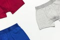 Men`s underwear, set of multi-colored underpants on white background flat lay top view copy space. Fashion blog, natural underwea Royalty Free Stock Photo