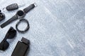 Men's watches, glasses, smartphone, accessories. Black accessories on a gray background