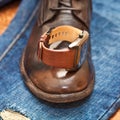 Men's watches, leather shoes, jeans.