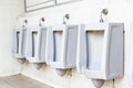 Men`s white urinals design, Close up row of outdoor urinals men public toilet Royalty Free Stock Photo