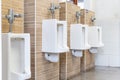 Men`s white urinals design, Close up row of outdoor urinals men public toilet Royalty Free Stock Photo