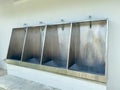 Men`s white urinals design, Close up row of outdoor urinals men public toilet Royalty Free Stock Photo