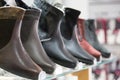 Men`s winter boots. Men`s winter boots in clothing store with selective focus