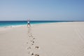 Men On Sandy Beach - Blue Ocean And Sky