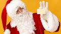 Men in Santa Claus costume suggesting to give you good Christmas mood Royalty Free Stock Photo
