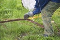 Men sawing metal with hand grinder outdoors, Royalty Free Stock Photo