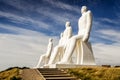 Men at sea white sculptures on the coast of Denmark with no people. Famous white statues of Mennesket ved Havet on summer day with
