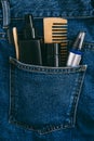 Men self care beauty kit, male beauty care cosmetic products and devices in blue jeans denim pocket. Man self care set Royalty Free Stock Photo