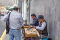 Men sew on sewing machines on the street. Quito, Ecuador. 01/13/2019