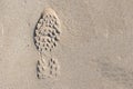 Men shoe trace ,footprint , on sand surface with copy space