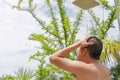 Men showering outdoor in the resort.
