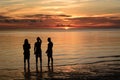Men silhouettes at sunset. White beach. Boracay. Western Visayas. Philippines