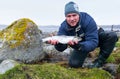 Men with silver seatrout Royalty Free Stock Photo