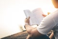 Men sit reading book in quiet nature. Royalty Free Stock Photo