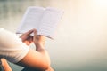 Men sit reading book in quiet nature. Royalty Free Stock Photo