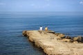 Men sitting on the pier