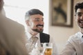 Men Socialsiing At Wedding Reception