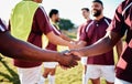 Men, sports and handshake for greeting, introduction or sportsmanship on the grass field outdoors. Sport team shaking Royalty Free Stock Photo