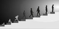Men, stages of development. Silhouettes on stairs going towards the light. The speed of life Royalty Free Stock Photo