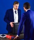 Men in suit or businessmen meet for handover of black