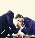 Men in suit or businessmen with screaming face compete in armwrestling on table on white background. Winner and defeated