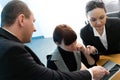 Men in suit with girl and women with notebook Royalty Free Stock Photo