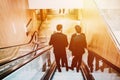 4 men in suit in the shopping center or buisnes center. Royalty Free Stock Photo