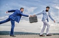 Men suits handover briefcase. Rascal racketeer extortionist cheating business transaction. Risky transaction. Fraud and Royalty Free Stock Photo