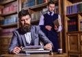 Men in suits, professors, aristocrats in library or retro interior Royalty Free Stock Photo