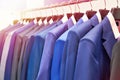 Men suits with shirts in clothing store Royalty Free Stock Photo