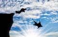 Men in suits for a wingsuit jump with mountains against sky Royalty Free Stock Photo