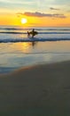 Men with surfboard with sunset view at Kuta beach Bali Indonesia Royalty Free Stock Photo