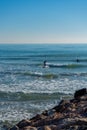 Men surfing in the Mediterranean Sea