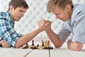 Men at the table and armwrestling Royalty Free Stock Photo