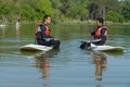 men talking while sitting on their paddleboard Royalty Free Stock Photo