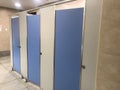 Men Toilet cubicles Beige color wall partition and Blue color attractive doors coming in ready made from the industry and which is